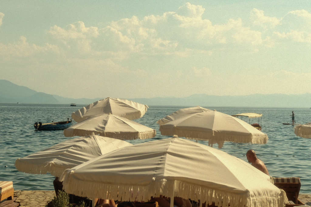 White umbrellas in front of lake Ohrid.