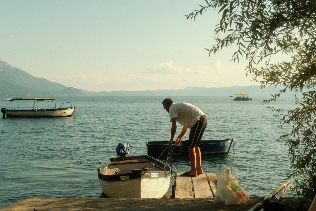 A fisherman is setting up his boat.